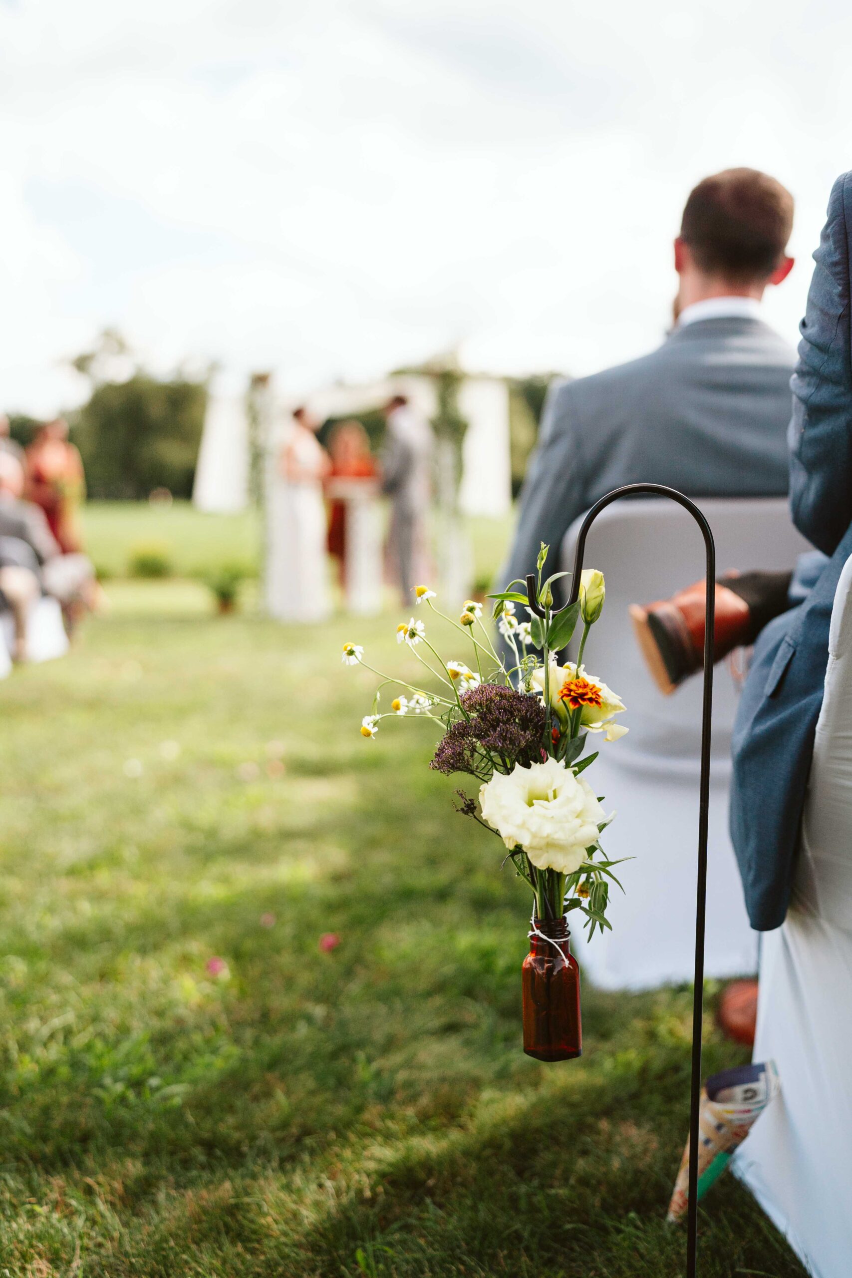 NH New England Rockingham Country Club wedding summer seacoast photographer  New Hampshire wild flowers artistic aesthetic ceremony details bottles with hanging flowers