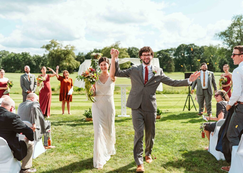 NH New England Rockingham Country Club wedding summer seacoast photographer  New Hampshire  ceremony fun walking down the aisle petal toss candid run exit dried flowers 