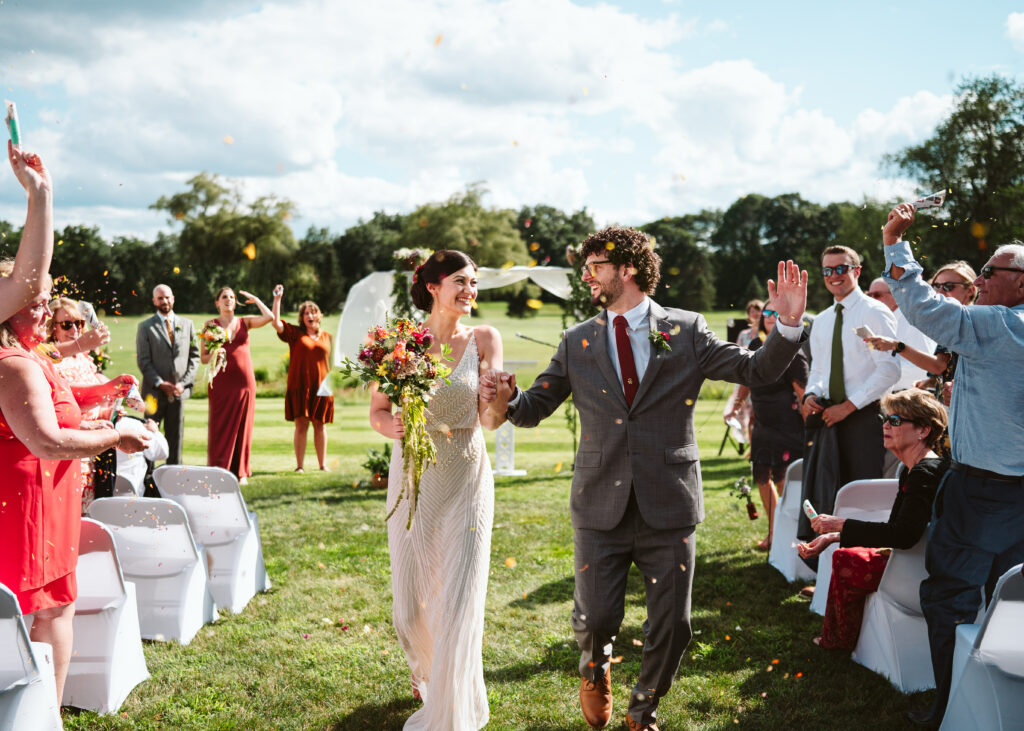 NH New England Rockingham Country Club wedding summer seacoast photographer  New Hampshire  ceremony fun walking down the aisle petal toss candid run exit dried flowers 