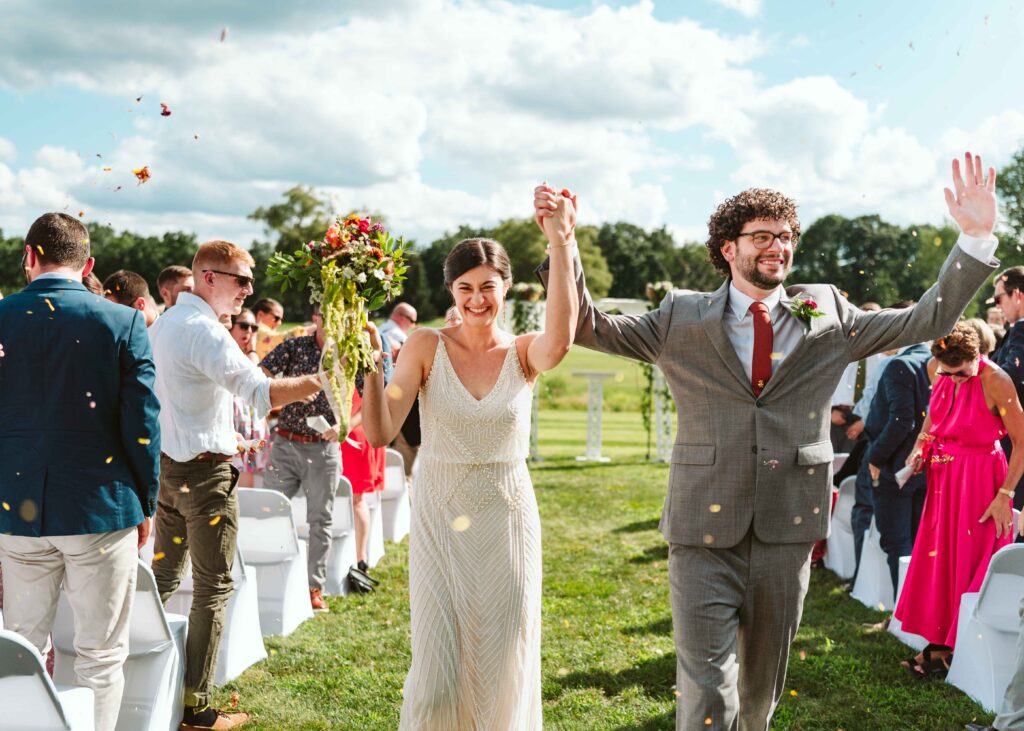 NH New England Rockingham Country Club wedding summer seacoast photographer  New Hampshire  ceremony fun walking down the aisle petal toss candid run exit dried flowers 