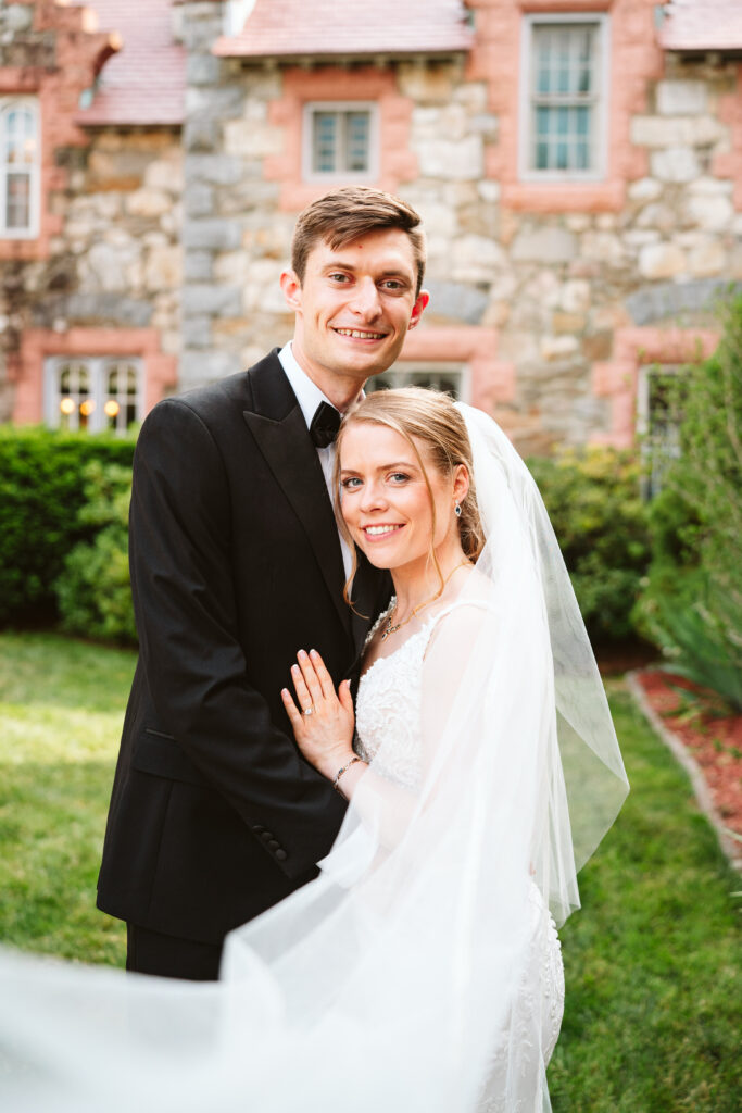 Romantic photo of a New Hampshire couple at a castle with the best New England wedding photographer. Searles castle wedding New England